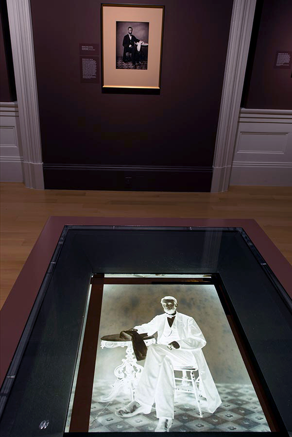 Installation view of the exhibition ‘Dark Fields of the Republic: Alexander Gardner Photographs, 1859-1872’ at the National Portrait Gallery, Washington showing the "Imperial" glass-plate negative of President Abraham Lincoln from his August 9, 1863, sitting at Gardner's Washington studio, with a print from the negative on the wall behind