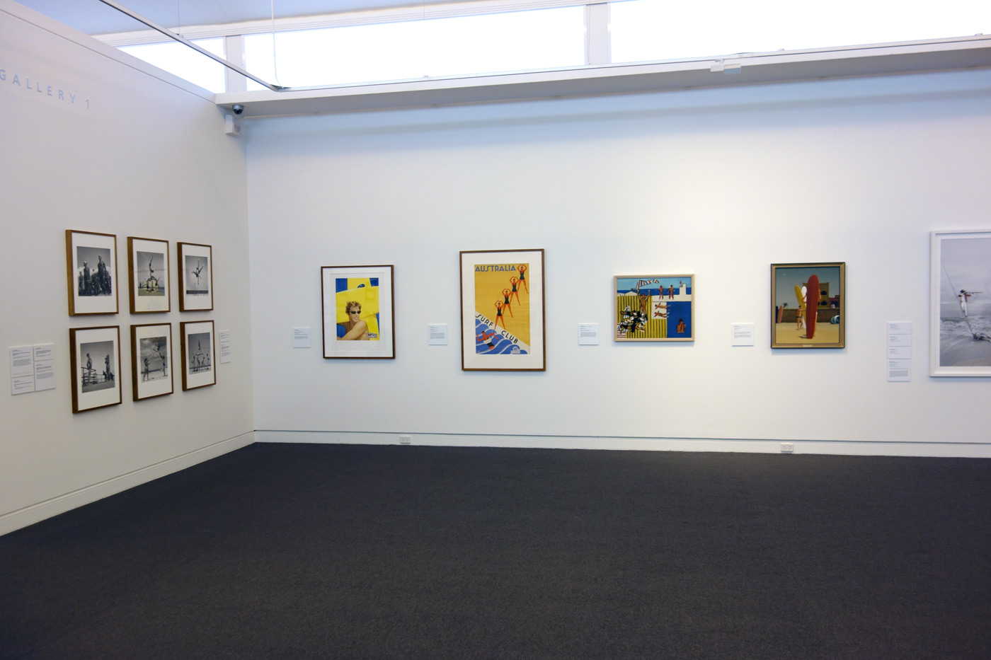 Installation view of the exhibition 'On the beach' at the Mornington Peninsula Regional Art Gallery showing at far left, George Caddy's beachobatic photographs, and on the far wall Sidney Nolan's 'Bathers' (1943) and Jeffrey Smart's 'Surfers Bondi' (1963) Installation view of the exhibition 'On the beach' at the Mornington Peninsula Regional Art Gallery showing at far left, George Caddy's beachobatic photographs, and on the far wall Sidney Nolan's 'Bathers' (1943) and Jeffrey Smart's 'Surfers Bondi' (1963)