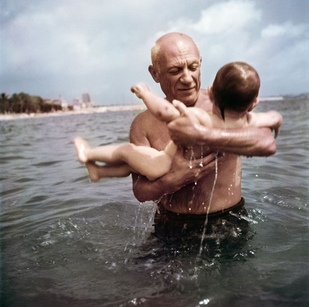 Robert Capa (American, 1913-1954) 'Pablo Picasso playing in the water with his son Claude, near Vallauris, France' 1948