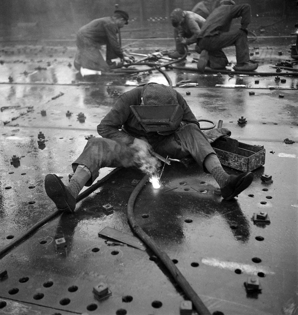 François Kollar (French born Slovakia, 1904-1979) 'Dans le port, à bord. Super Ile de France: cisaillage au chalumeau oxhydrique' (In port, on board. Super Ile de France: cutting using the welding torch. Company building sites and workshops of Saint Nazaire Penhoët) 1931