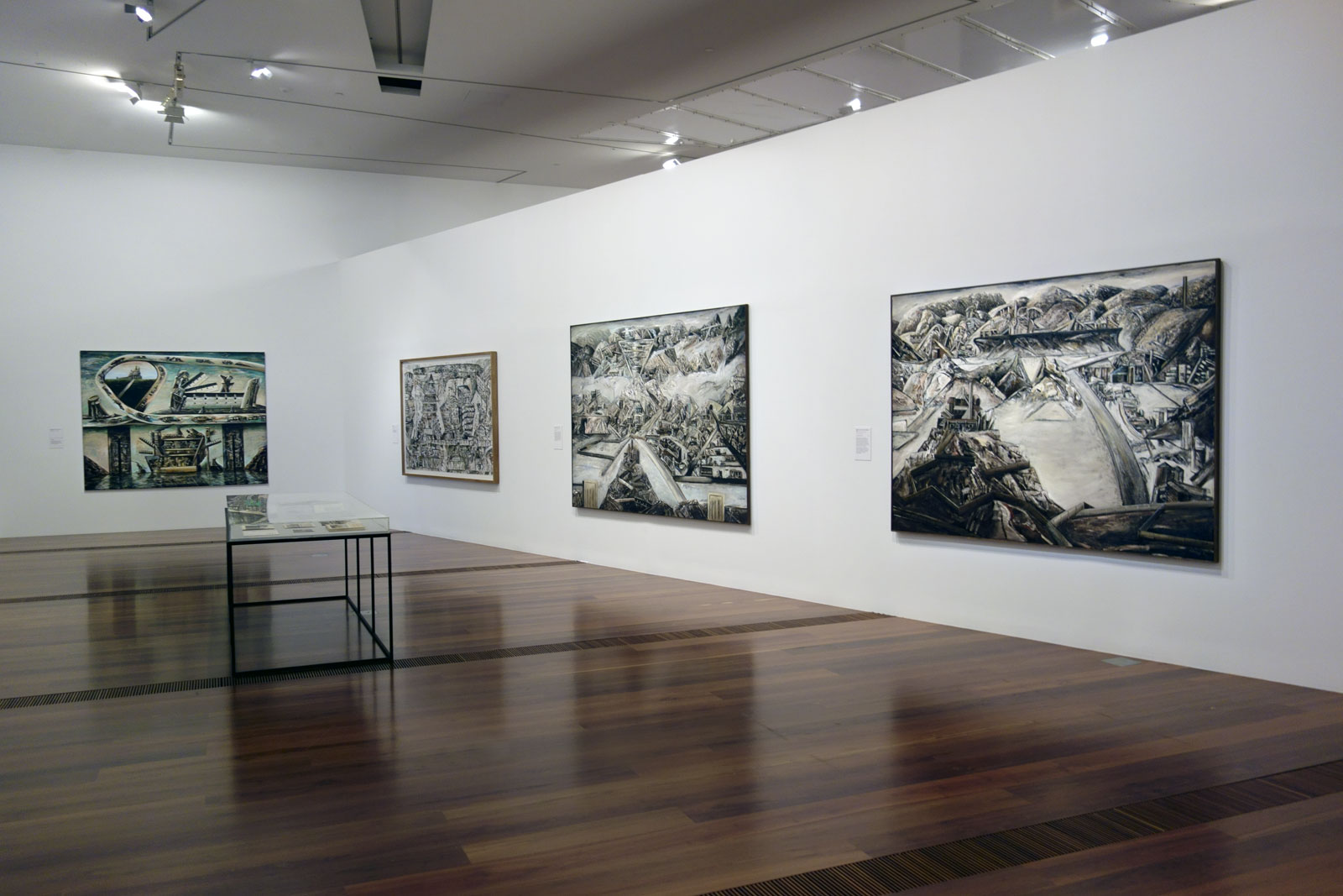 Installation view of the exhibition 'Jan Senbergs: Observation – Imagination' at The Ian Potter Centre: NGV Australia with 'Sticht's view to the smelters 1' at right