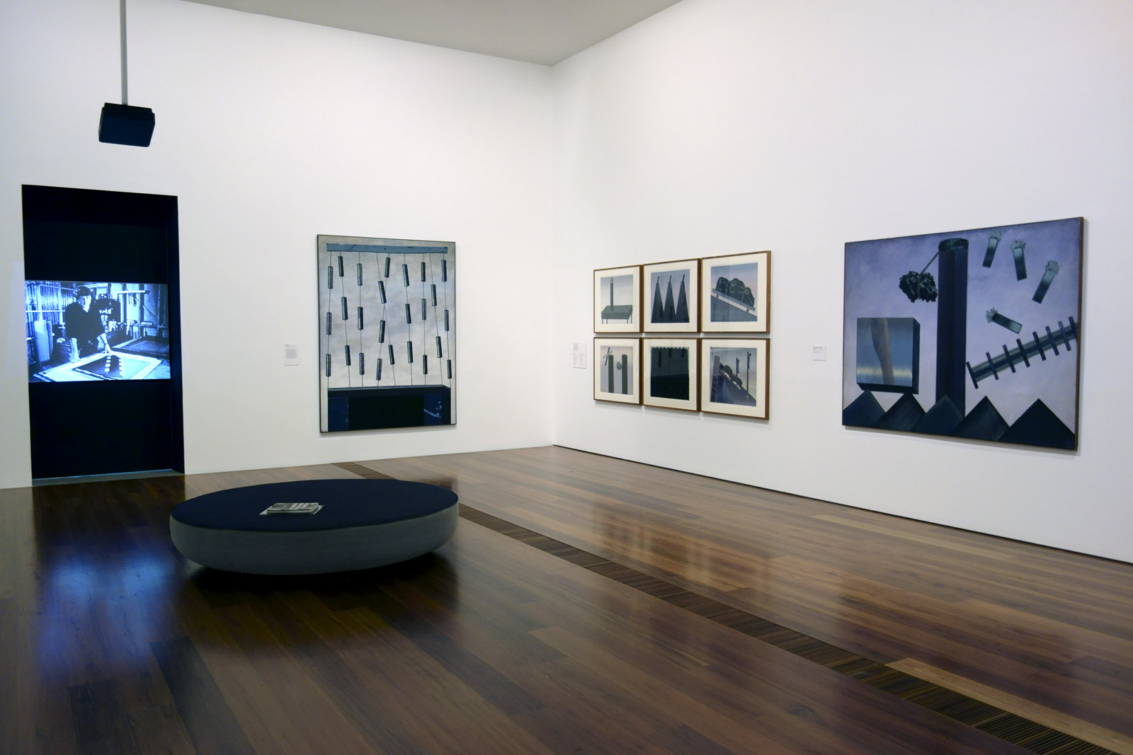 Installation view of the exhibition 'Jan Senbergs: Observation - Imagination' at The Ian Potter Centre: NGV Australia showing at right, 'Column and still objects 1' (1968)