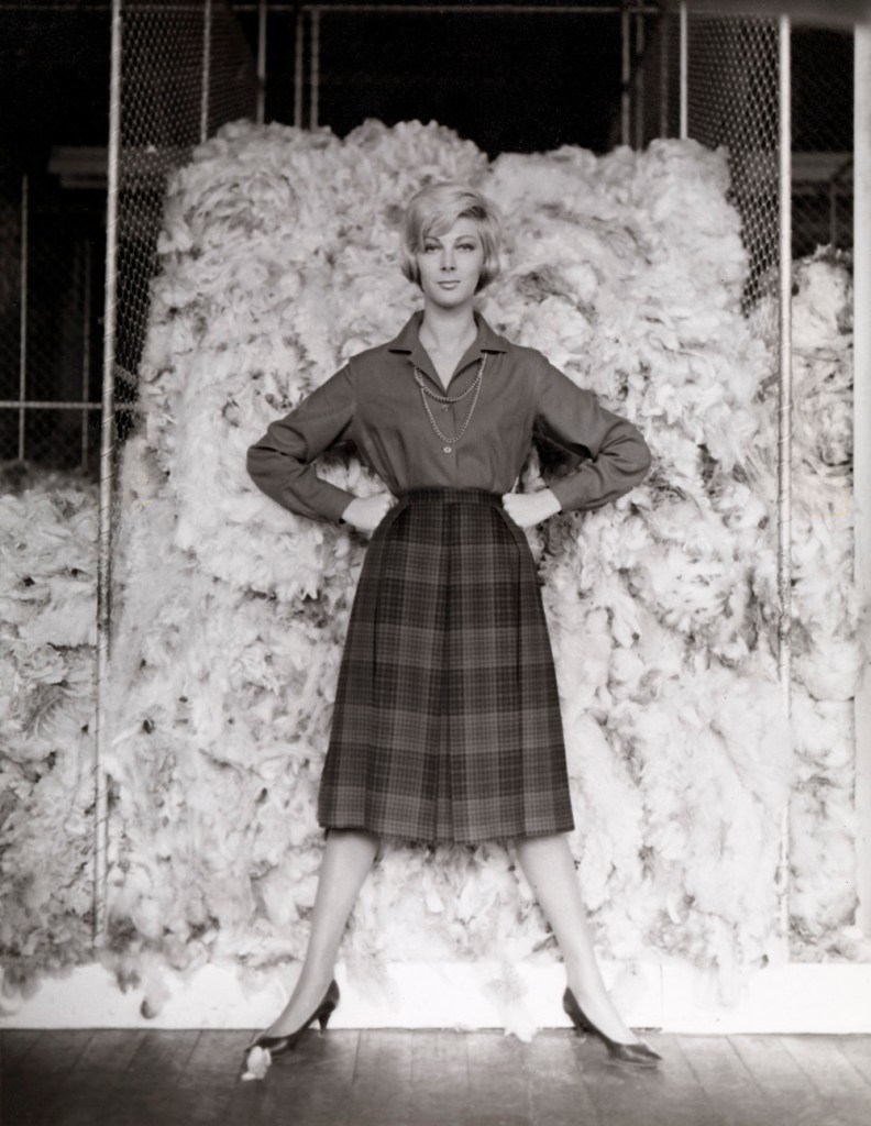 Henry Talbot (Germany 1920 - Australia 1999, Australia from 1940) 'No title (Fashion illustration, model Janice Wakely standing in front of wool bale)' 1961-1966