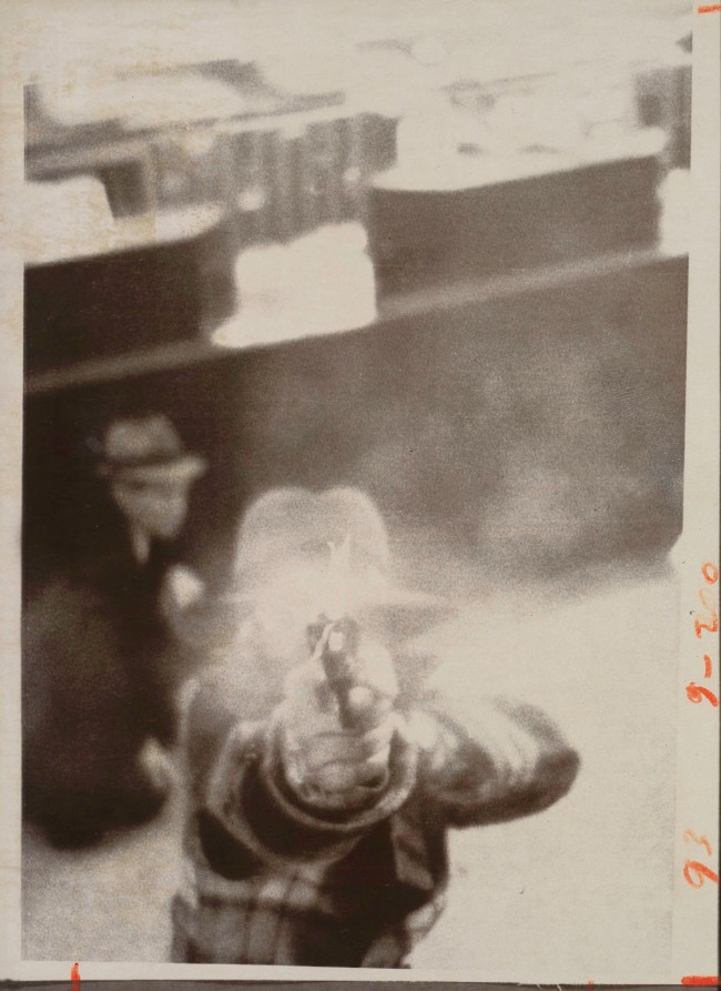 United Press International (American) '[Bank Robber Aiming at Security Camera, Cleveland, Ohio]' March 8, 1975