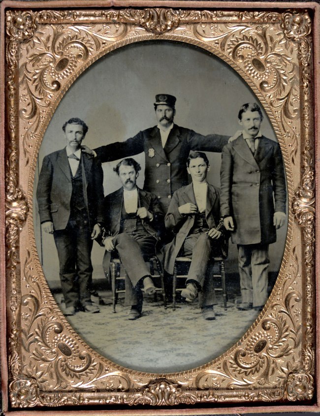 Unknown photographer (American). 'Policeman Posing with Four "Collared" Thugs' c. 1875