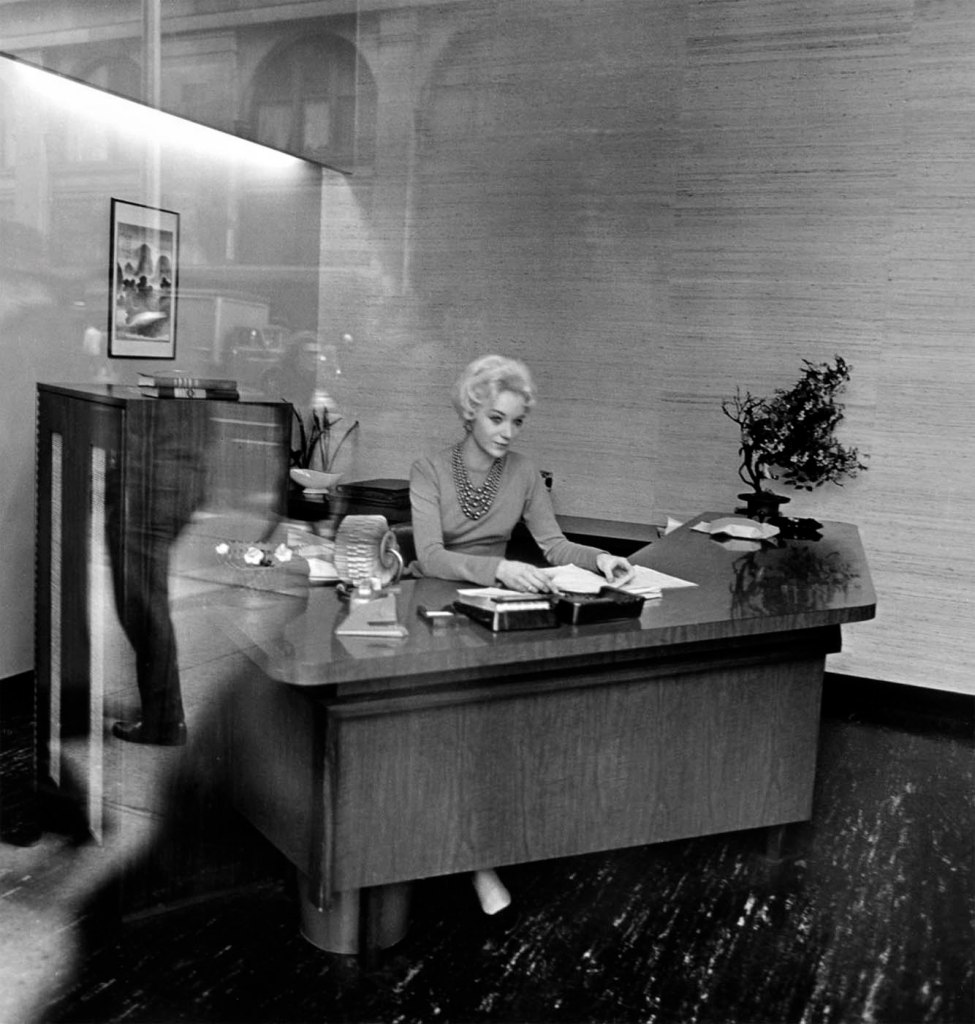 Diane Arbus (American, 1923-1971) 'Blonde receptionist behind a picture window, N.Y.C.' 1962