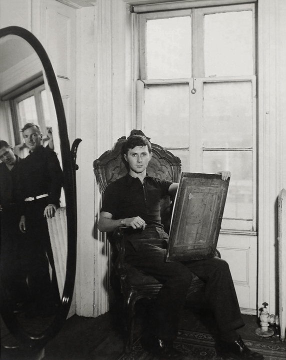 George Platt Lynes (American, 1907-1955) 'George Tooker at 5 St. Luke's Place, New York, with Paul Cadmus and Jared French in Mirror' c. 1940