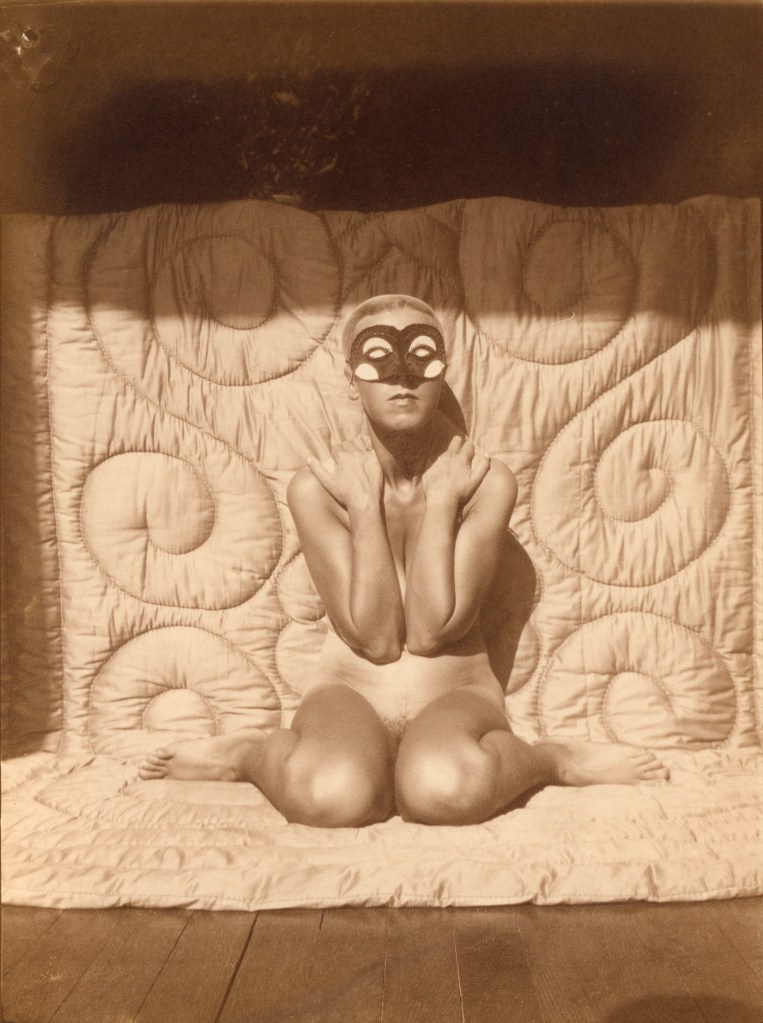 Claude Cahun (French, 1894-1954) 'Self-portrait (kneeling, naked, with mask)' c. 1928
