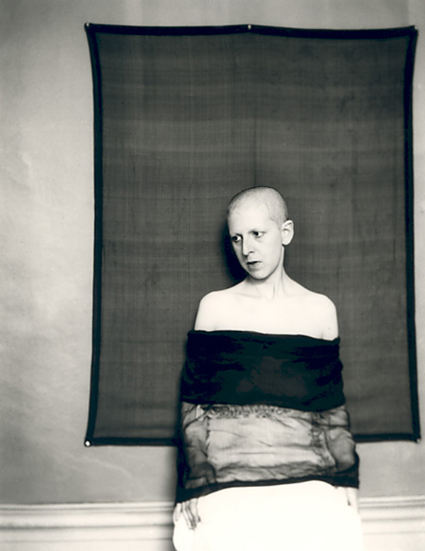 Claude Cahun (French, 1894-1954) 'Self-portrait (shaved head, material draped across body)' 1920