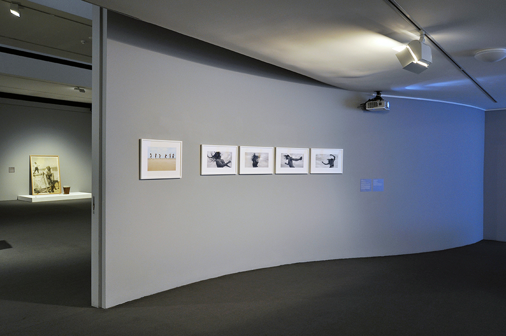 Installation view of the exhibition 'Under the sun Reimagining Max Dupain's 'Sunbaker'' at Monash Gallery of Art, Melbourne showing Nasim Nasr's 'Still for Eighty Years' (2017)