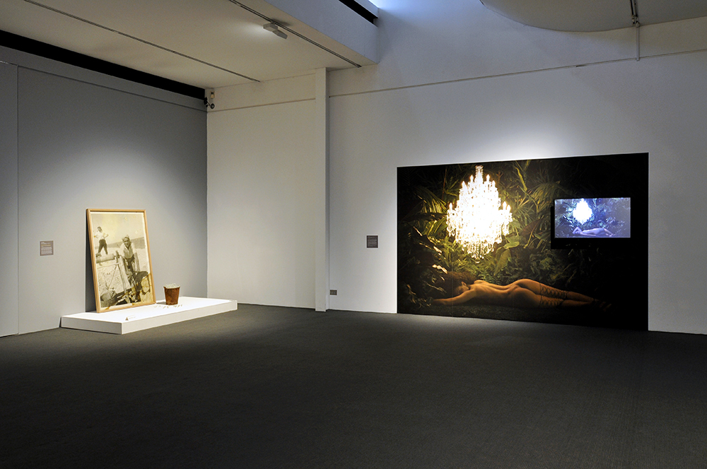 Installation view of the exhibition 'Under the sun Reimagining Max Dupain's 'Sunbaker'' at Monash Gallery of Art, Melbourne showing at right, Angela Tiatia's 'Dark Light' (2017)