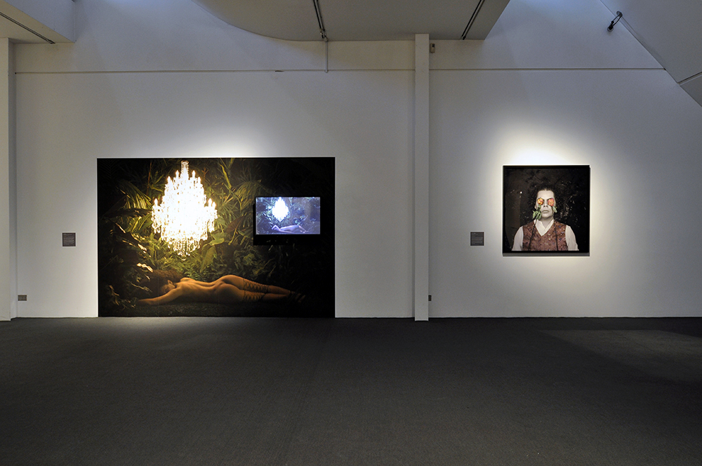 Installation view of the exhibition 'Under the sun Reimagining Max Dupain's 'Sunbaker'' at Monash Gallery of Art, Melbourne showing at left, Angela Tiatia's 'Dark Light' (2017)