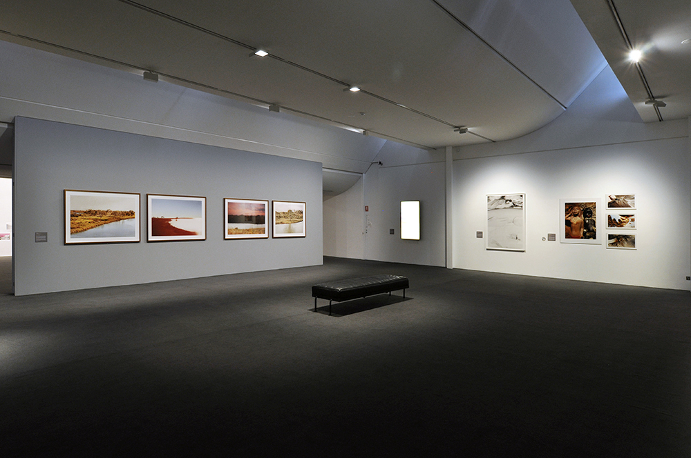 Installation view of the exhibition 'Under the sun Reimagining Max Dupain's 'Sunbaker'' at Monash Gallery of Art, Melbourne showing at left, Peta Clancy's 'Fissures in time' (2017)