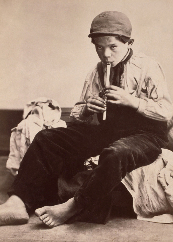 Oscar Gustave Rejlander. 'No title (Shoeless boy playing whistle)' c. 1860