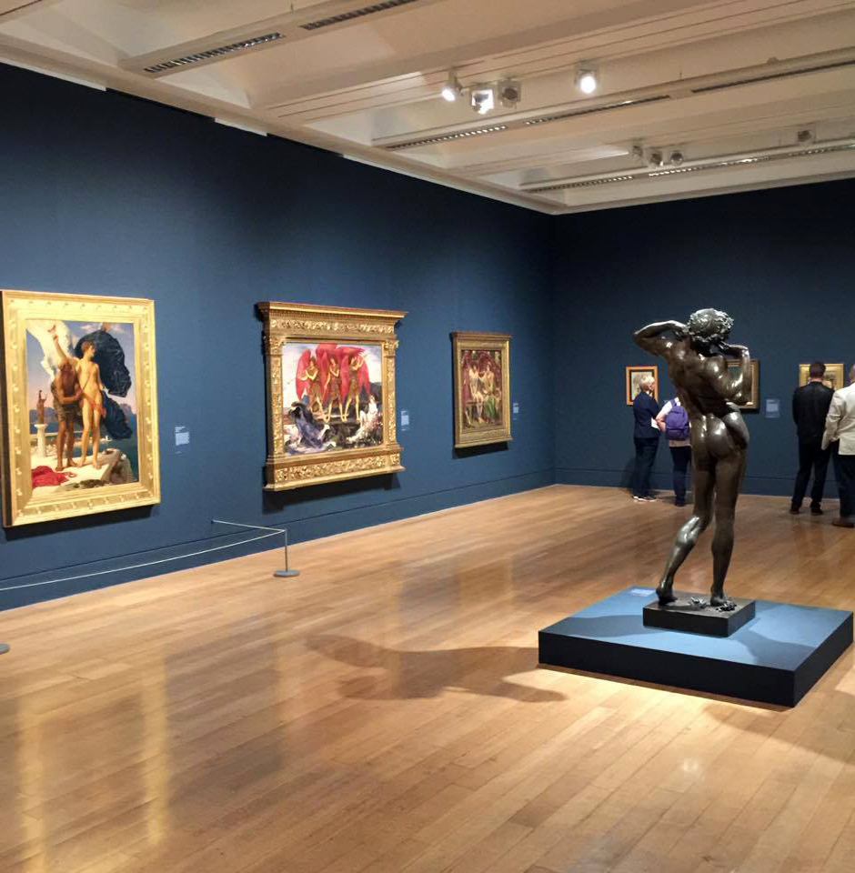 Installation view of Room 1 of the exhibition 'Queer British Art' at Tate Britain with Frederic Leighton's 'The Sluggard' (1885, bronze) in the middle of the room