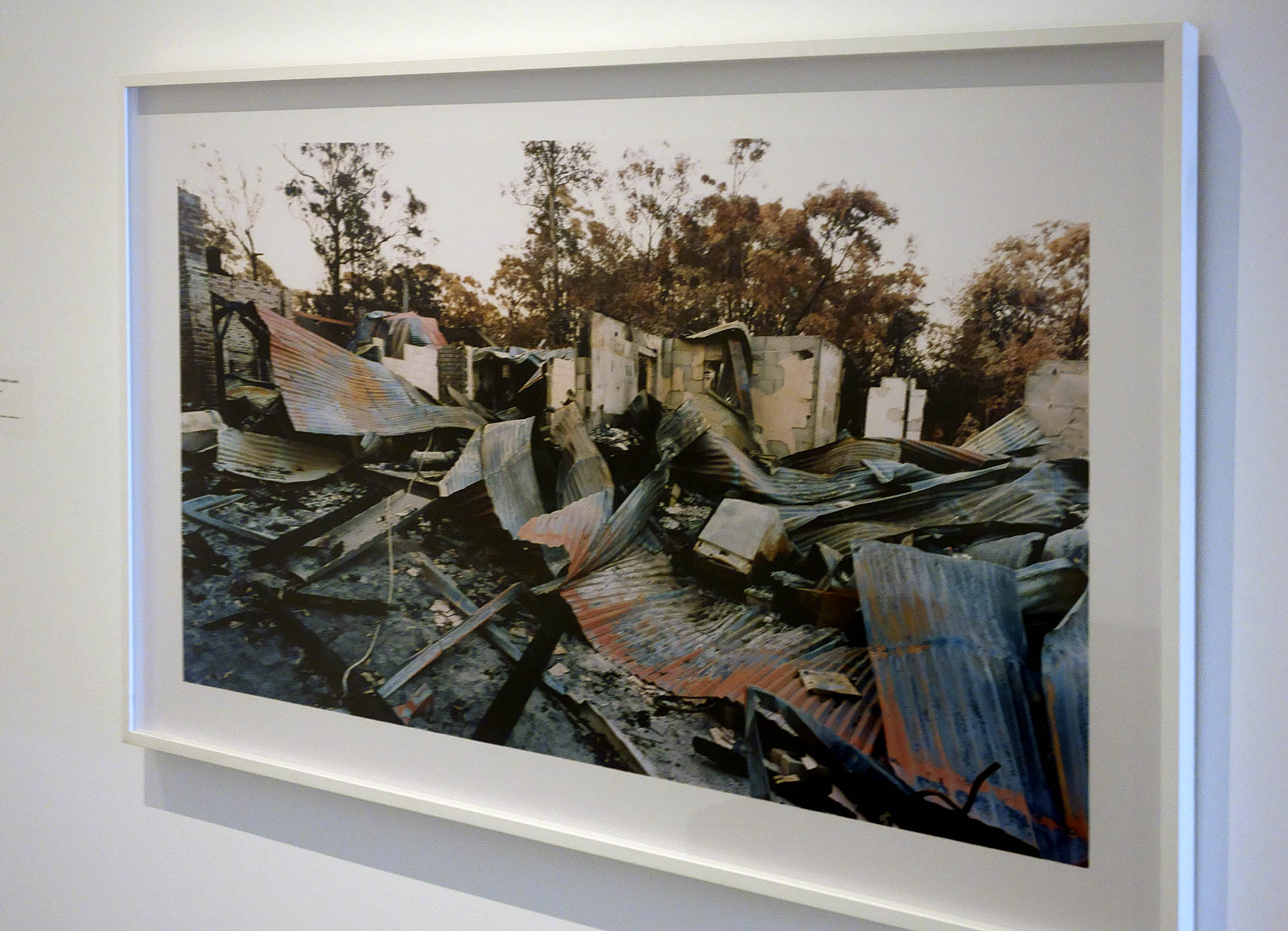 Installation view of Rosemary Laing's work 'swanfires, John and Kathy's auto services' (2002-2004, C Type photograph,Courtesy of the artist and Tolarno Galleries, Melbourne) from the series 'swanfires'