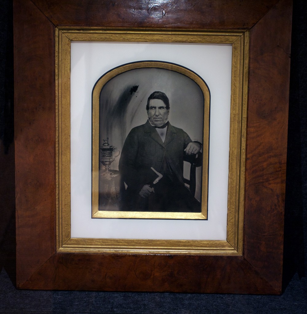 Unknown photographer. 'Robert Lyall with the New Norfolk Cup' 1851 Ambrotype (installation view) from the exhibition 'Colony: Australia 1770-1861' at NGV Australia at Federation Square, Melbourne, March - July, 2018