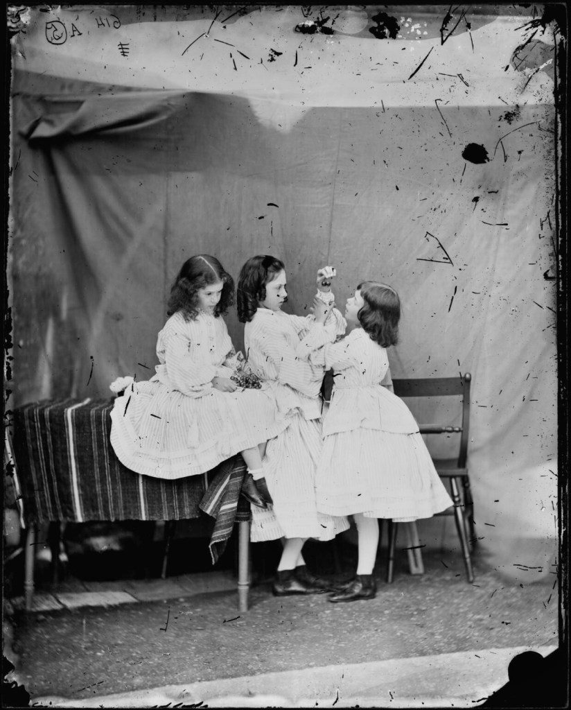 Lewis Carroll (English, 1832-1898) ''Open your mouth, and shut your eyes' (Edith Mary Liddell; Ina Liddell; Alice Liddell)' July 1860