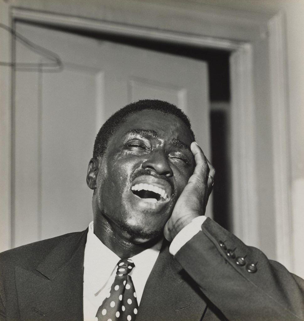 Milton Rogovin (American, 1909-2011) 'Storefront Churches, Buffalo, preacher head in hand, eyes closed' 1958-1961