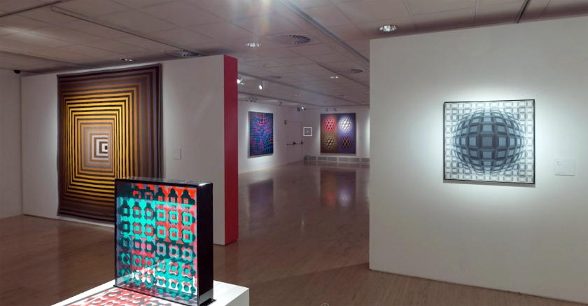 Installation view of the exhibition 'Victor Vasarely. The Birth of Op Art' at the Museo Nacional Thyssen-Bornemisza, Madrid showing from left to right in the bottom image, the works 'Vonal-Fegn', 1968-1971; 'Helios', 1964 (multiple) and 'Villog', 1979