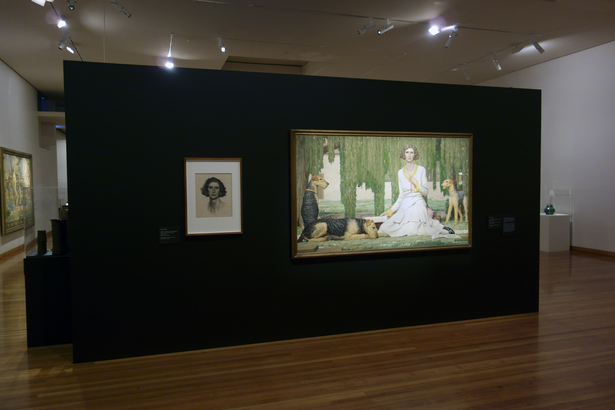 Installation view of the exhibition 'Daughters of the Sun' showing the work 'Christian Waller with Baldur, Undine and Siren at Fairy Hills' by Napier Waller, 1932 Installation view of the exhibition 'Daughters of the Sun' showing the work 'Christian Waller with Baldur, Undine and Siren at Fairy Hills' by Napier Waller, 1932