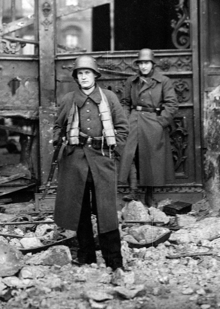 Willy Römer (German, 1887-1979) 'Street battles on Christmas Eve in Berlin. Naval ratings in front of the ruined Palace entrance after bombardment by artillery' 24.12.1918 (detail)