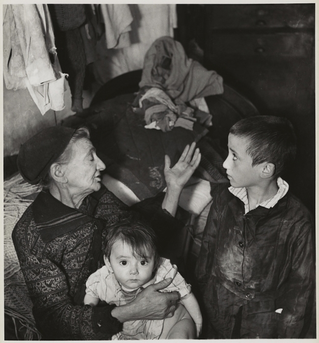 Roman Vishniac (1897-1990) '[Grandmother and grandchildren in basement dwelling, Krochmaina Street, Warsaw]' c. 1935-1938