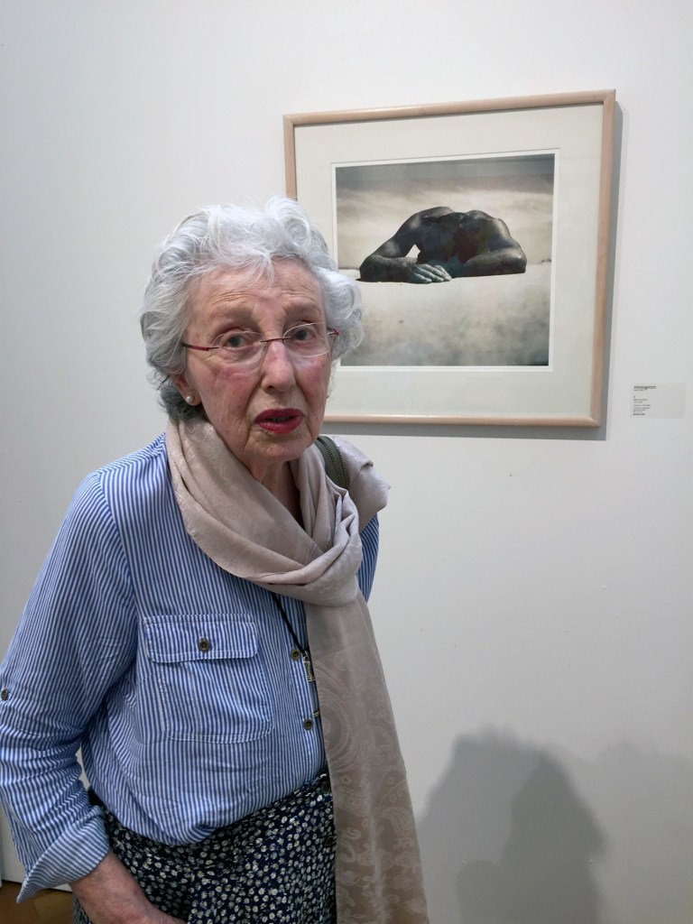 Marcus Bunyan (Australian, b. 1958) 'Joyce Evans standing in front of Max Dupain's 'Sunbaker' 1937' 2018