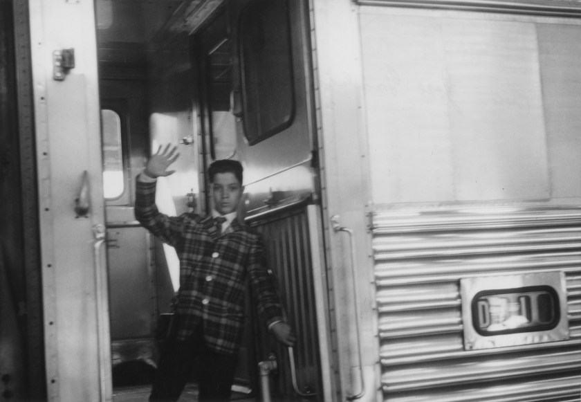 José Gonçalves (American, born 1927) 'Flávio Waves Goodbye to the Gonçalves Family from the Train That Will Take Him to New York, Denver, Colorado' Negative July 27, 1963, print about 1977