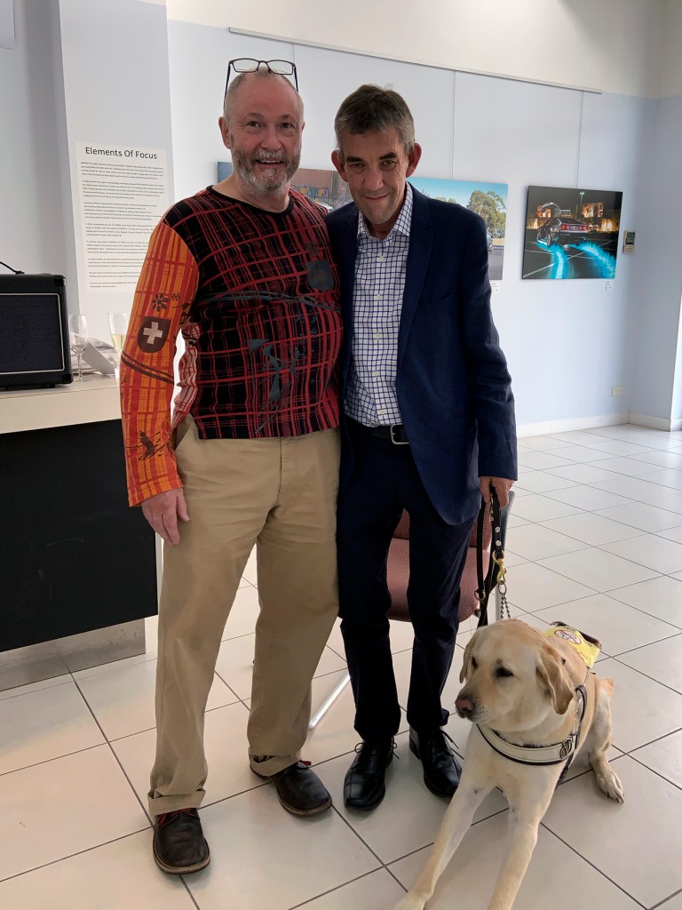 Marcus Bunyan with his friend Andrew Follows at the opening of his exhibition 'Elements of Focus'