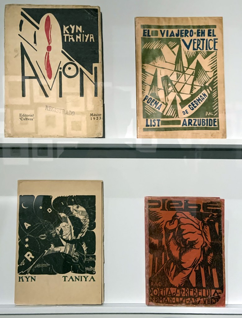 Installation view of the exhibition 'Into the Night: Cabarets and Clubs in Modern Art' at the Barbican Art Gallery, London showing Mexican printed books 1923-1927 Installation view of the exhibition 'Into the Night: Cabarets and Clubs in Modern Art' at the Barbican Art Gallery, London showing Mexican printed books 1923-1927
