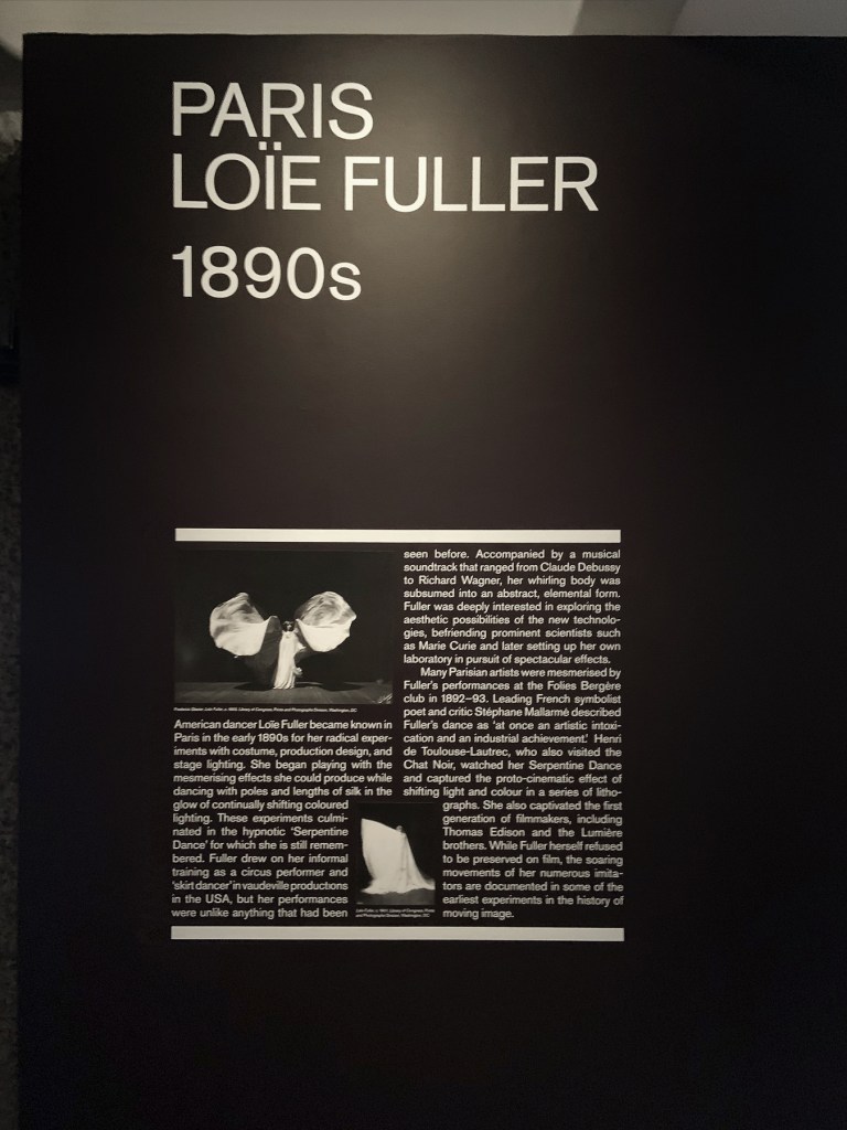 Paris: Loïe Fuller 1890s wall text from the exhibition 'Into the Night: Cabarets and Clubs in Modern Art' at the Barbican Art Gallery, Oct 2019 - Jan 2020 Paris: Loïe Fuller 1890s wall text from the exhibition 'Into the Night: Cabarets and Clubs in Modern Art' at the Barbican Art Gallery, Oct 2019 - Jan 2020
