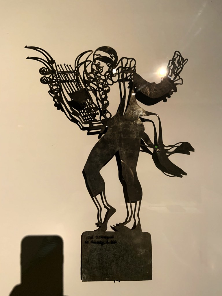 Installation view of the exhibition 'Into the Night: Cabarets and Clubs in Modern Art' at the Barbican Art Gallery, London showing Henri Rivière and Henry Somm's shadow theatre Installation view of the exhibition 'Into the Night: Cabarets and Clubs in Modern Art' at the Barbican Art Gallery, London showing Henri Rivière and Henry Somm's shadow theatre