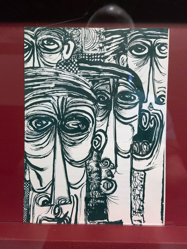 Installation view of the exhibition 'Into the Night: Cabarets and Clubs in Modern Art' at the Barbican Art Gallery showing some of the publishing output of the Mbari clubs Installation view of the exhibition 'Into the Night: Cabarets and Clubs in Modern Art' at the Barbican Art Gallery showing some of the publishing output of the Mbari clubs