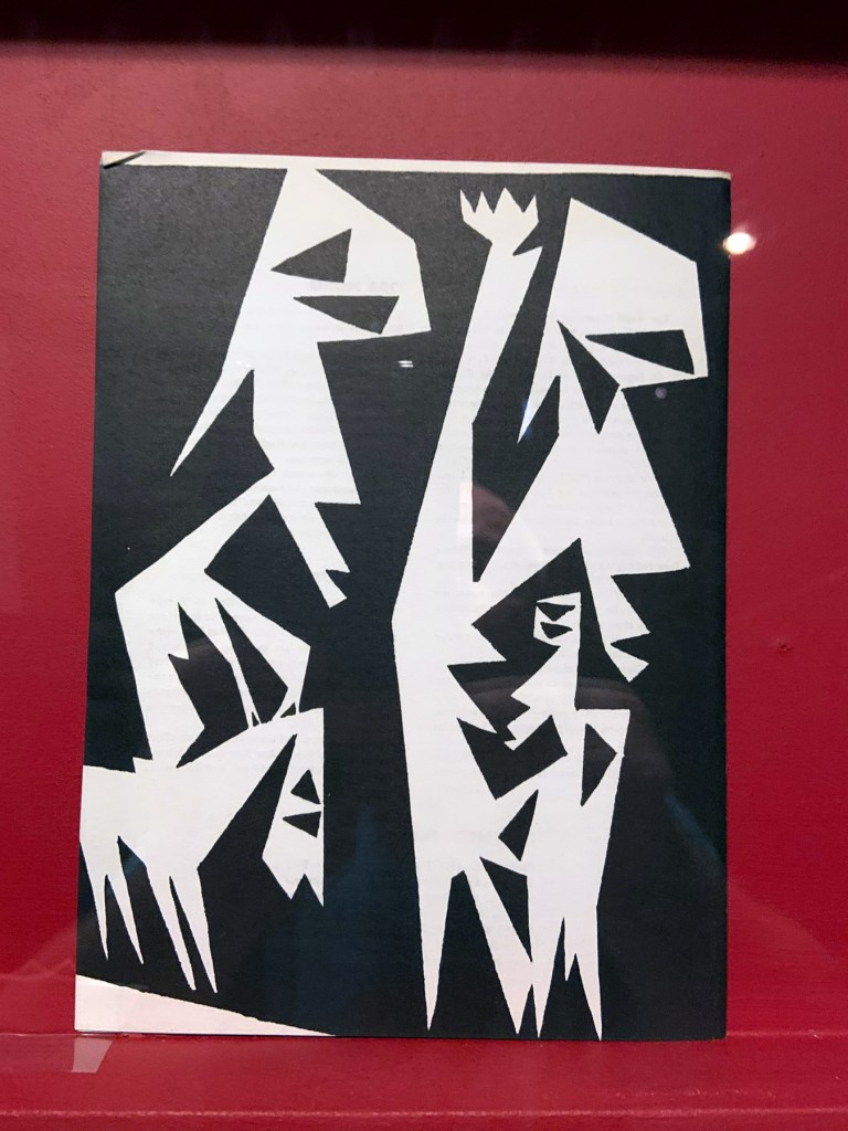 Installation view of the exhibition 'Into the Night: Cabarets and Clubs in Modern Art' at the Barbican Art Gallery showing some of the publishing output of the Mbari clubs Installation view of the exhibition 'Into the Night: Cabarets and Clubs in Modern Art' at the Barbican Art Gallery showing some of the publishing output of the Mbari clubs