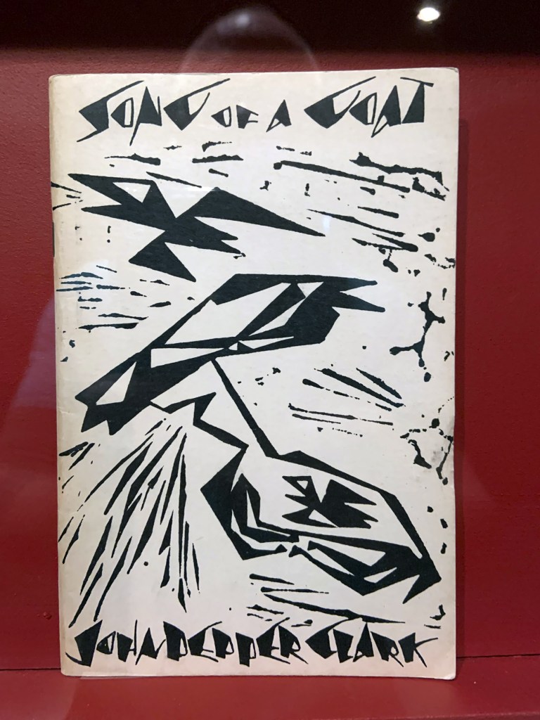 Installation view of the exhibition 'Into the Night: Cabarets and Clubs in Modern Art' at the Barbican Art Gallery showing some of the publishing output of the Mbari clubs Installation view of the exhibition 'Into the Night: Cabarets and Clubs in Modern Art' at the Barbican Art Gallery showing some of the publishing output of the Mbari clubs