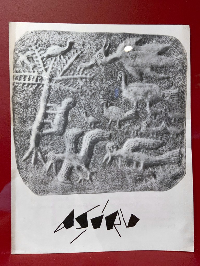 Installation view of the exhibition 'Into the Night: Cabarets and Clubs in Modern Art' at the Barbican Art Gallery showing some of the publishing output of the Mbari clubs Installation view of the exhibition 'Into the Night: Cabarets and Clubs in Modern Art' at the Barbican Art Gallery showing some of the publishing output of the Mbari clubs