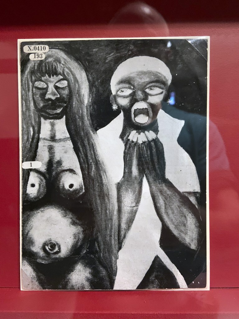 Installation view of the exhibition 'Into the Night: Cabarets and Clubs in Modern Art' at the Barbican Art Gallery showing some of the publishing output of the Mbari clubs Installation view of the exhibition 'Into the Night: Cabarets and Clubs in Modern Art' at the Barbican Art Gallery showing some of the publishing output of the Mbari clubs