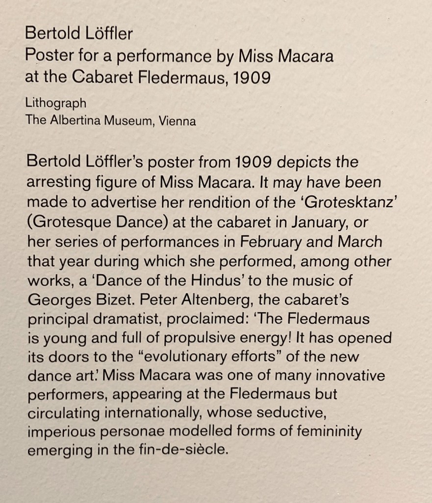 Wall text about the poster for a performance by Miss Macara from the exhibition 'Into the Night: Cabarets and Clubs in Modern Art' at the Barbican Art Gallery, London, October 2019 - January 2019 Wall text about the poster for a performance by Miss Macara from the exhibition 'Into the Night: Cabarets and Clubs in Modern Art' at the Barbican Art Gallery, London, October 2019 - January 2019