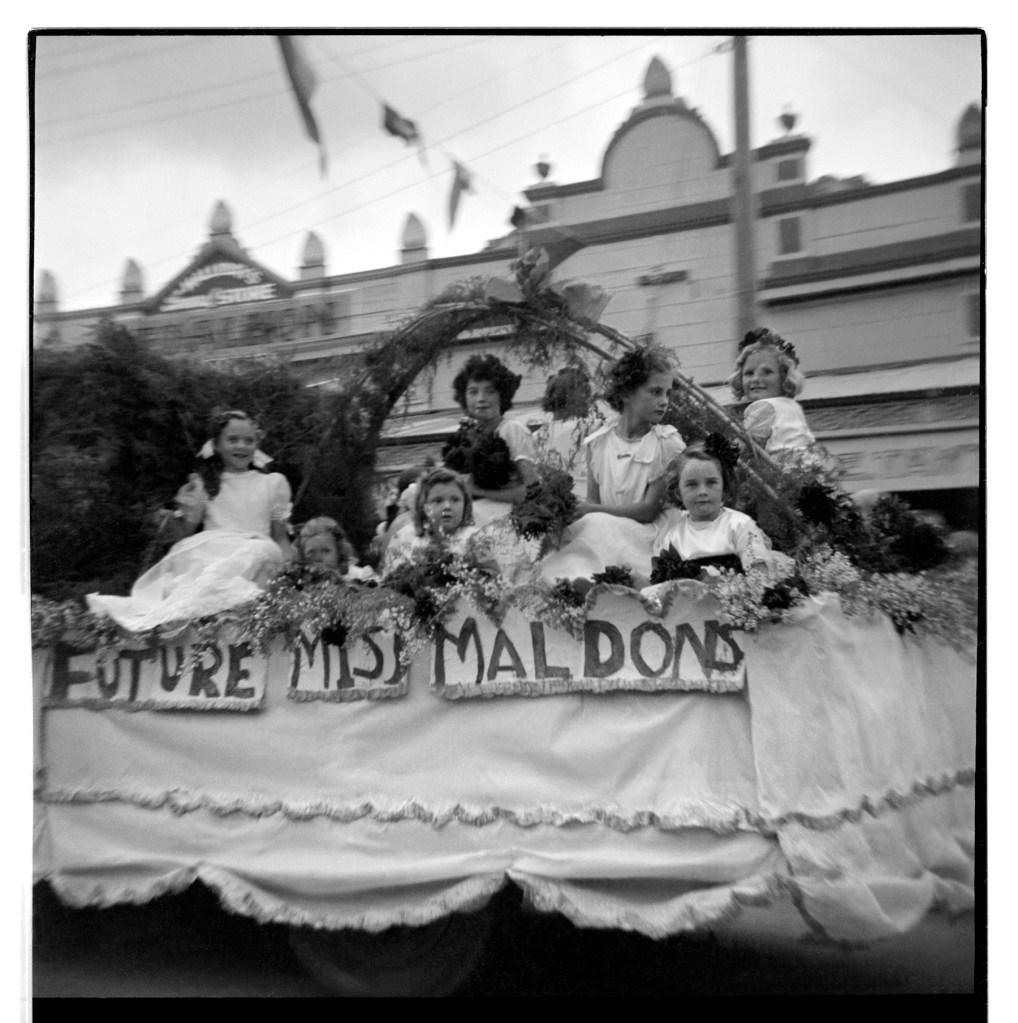 Unknown photographer (Australian) 'Untitled (Future Miss Maldons, Maldon Show, Maldon, Victoria, with Maldon Timber & Hardware at 28 Main Street in the background)' 1946-47
