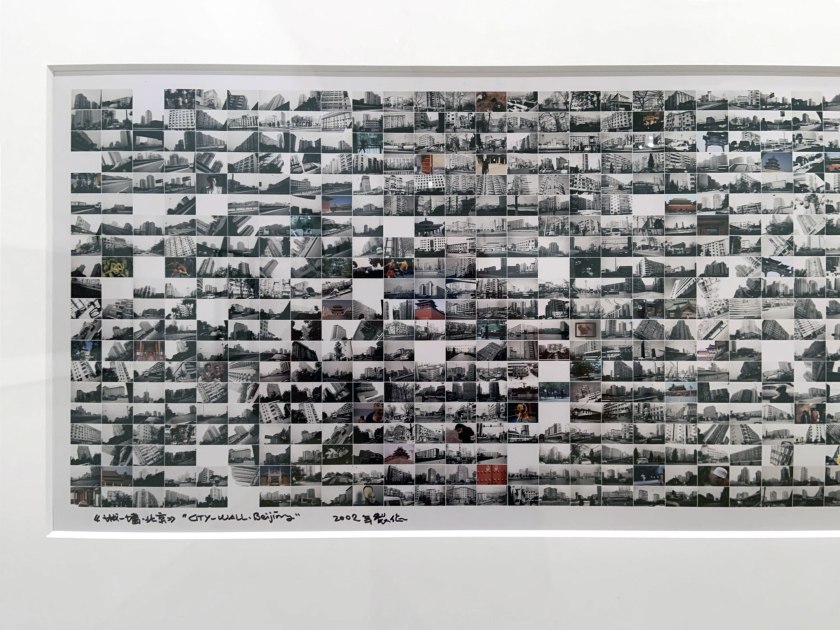 Installation view of the exhibition 'Turning Points: Contemporary Photography from China' at the National Gallery of Victoria, Melbourne showing Wang Qingsong's 'City walls' (2002)