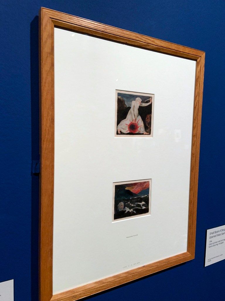 Installation view of the exhibition 'William Blake' at Tate Britain showing Small Book of Designs: Plate 7, 'Of life on his forsaken mountains' (installation view) 1794 and Small Book of Designs: Plate 8, 'dark seascape with figure in water' (installation view) 1794