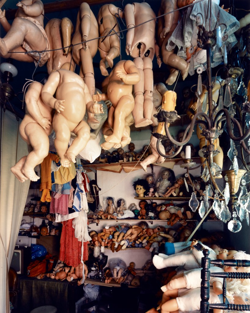 Jim Dow (American, b. 1942) 'Doll Repair Shop Window, Buenos Aires, Argentina' 1990