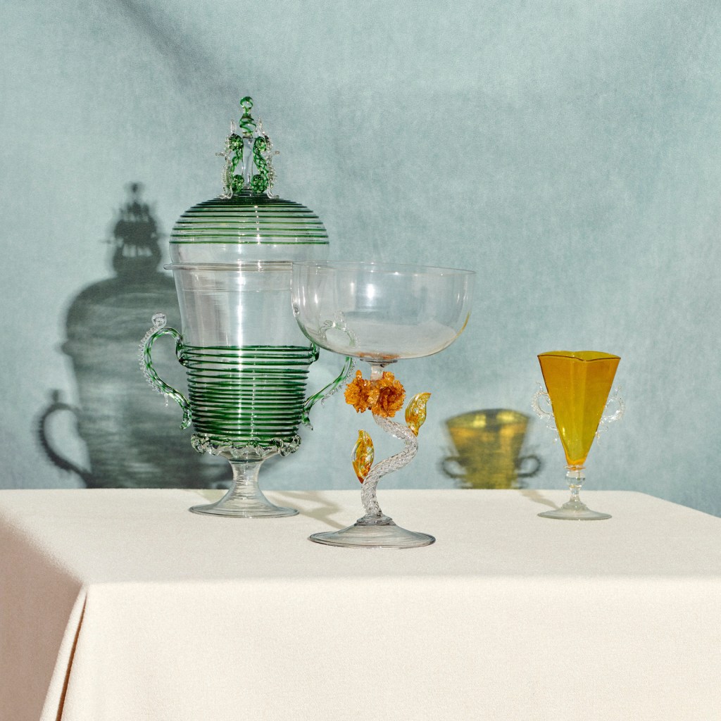 Installation view of 'Liquid Light: 500 Years of Venetian Glass' on display at NGV International showing Italian goblet, covered goblet and wine glass, all 19th century