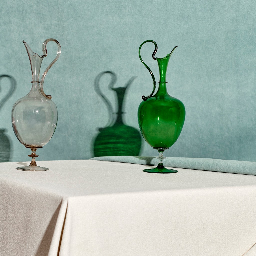 Installation view of 'Liquid Light: 500 Years of Venetian Glass' on display at NGV International showing Italian glass ewers 19th century