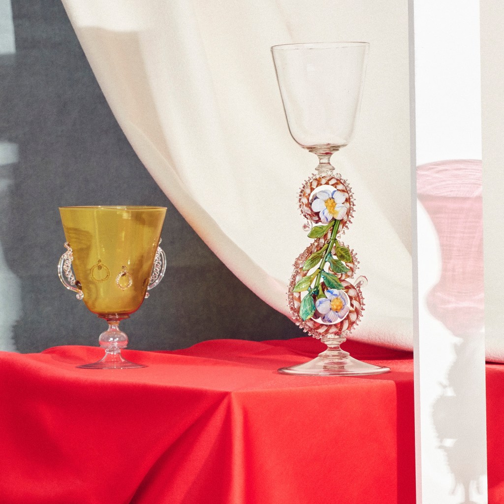 Installation view of 'Liquid Light: 500 Years of Venetian Glass' on display at NGV International showing Italian glass goblets 19th century