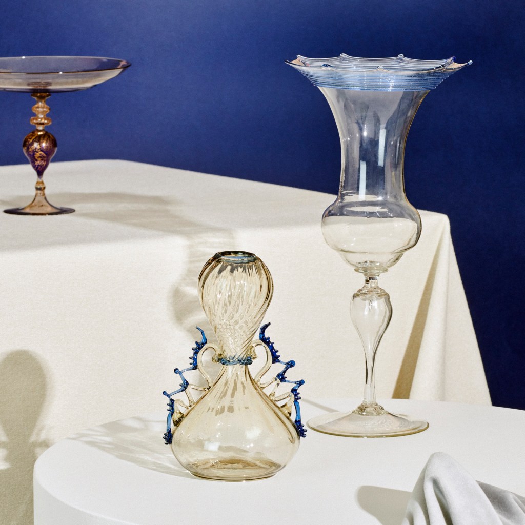 Installation view of 'Liquid Light: 500 Years of Venetian Glass' on display at NGV International showing Italian glass goblet, vase and tazza 19th century
