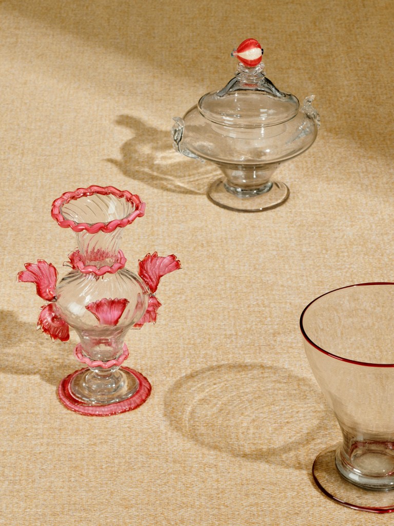 Installation view of 'Liquid Light: 500 Years of Venetian Glass' on display at NGV International showing Italian glass, covered bowl and goblet from the 18th century