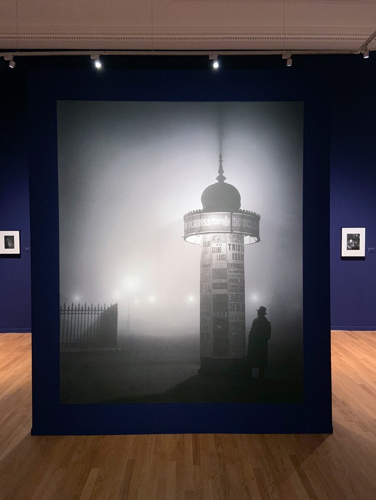 Installation view of the exhibition 'Brassaï' at Foam, Amsterdam showing a modern enlargement of Brassaï's 'Morris Column, avenue de l'Observatoire' 1934 