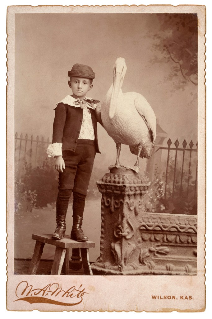 W. A. White, Wilson, KS. 'My first baby friend Tompie and his pet' 1896